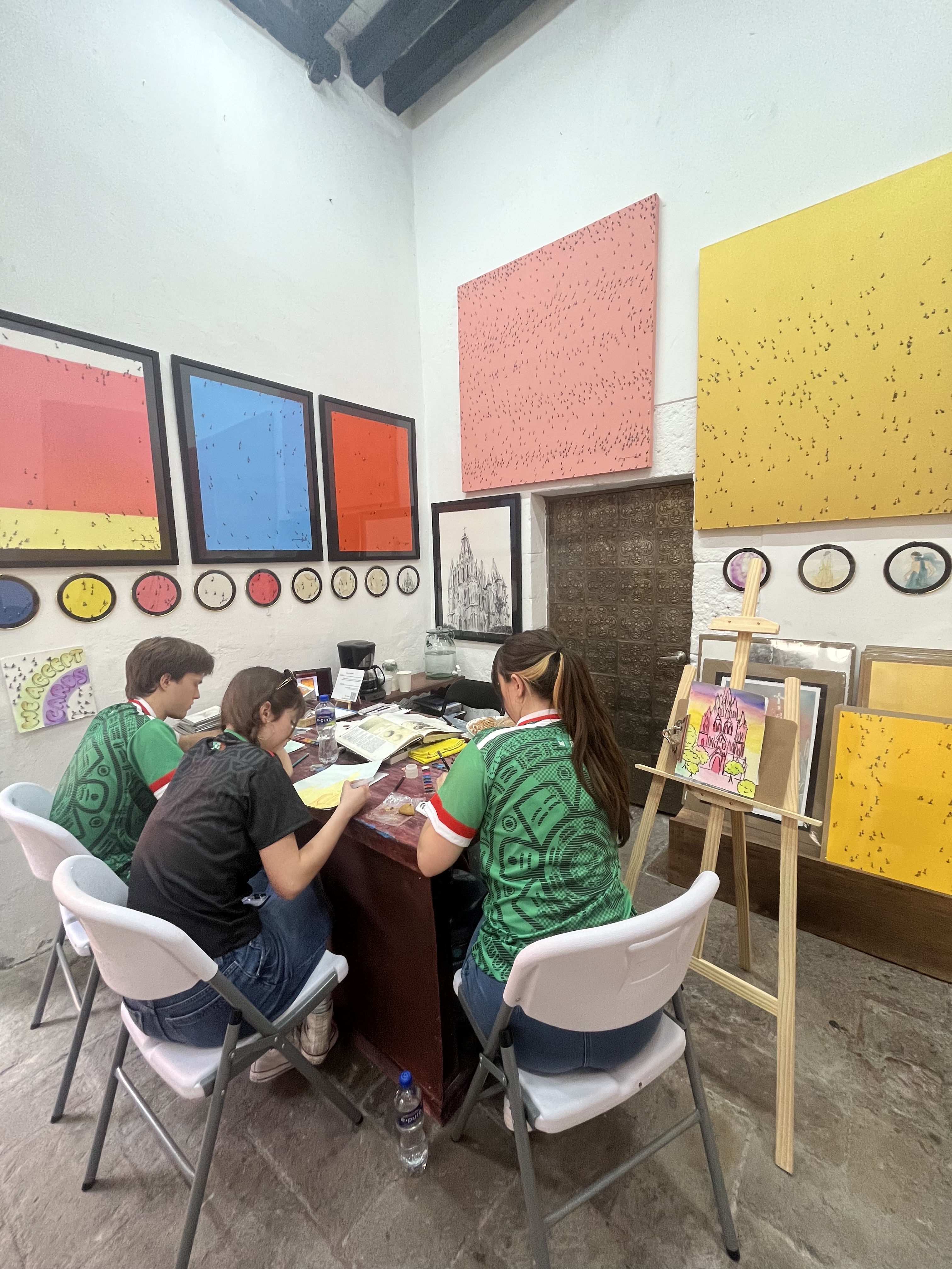Young guests enjoying a guided art session inside the gallery