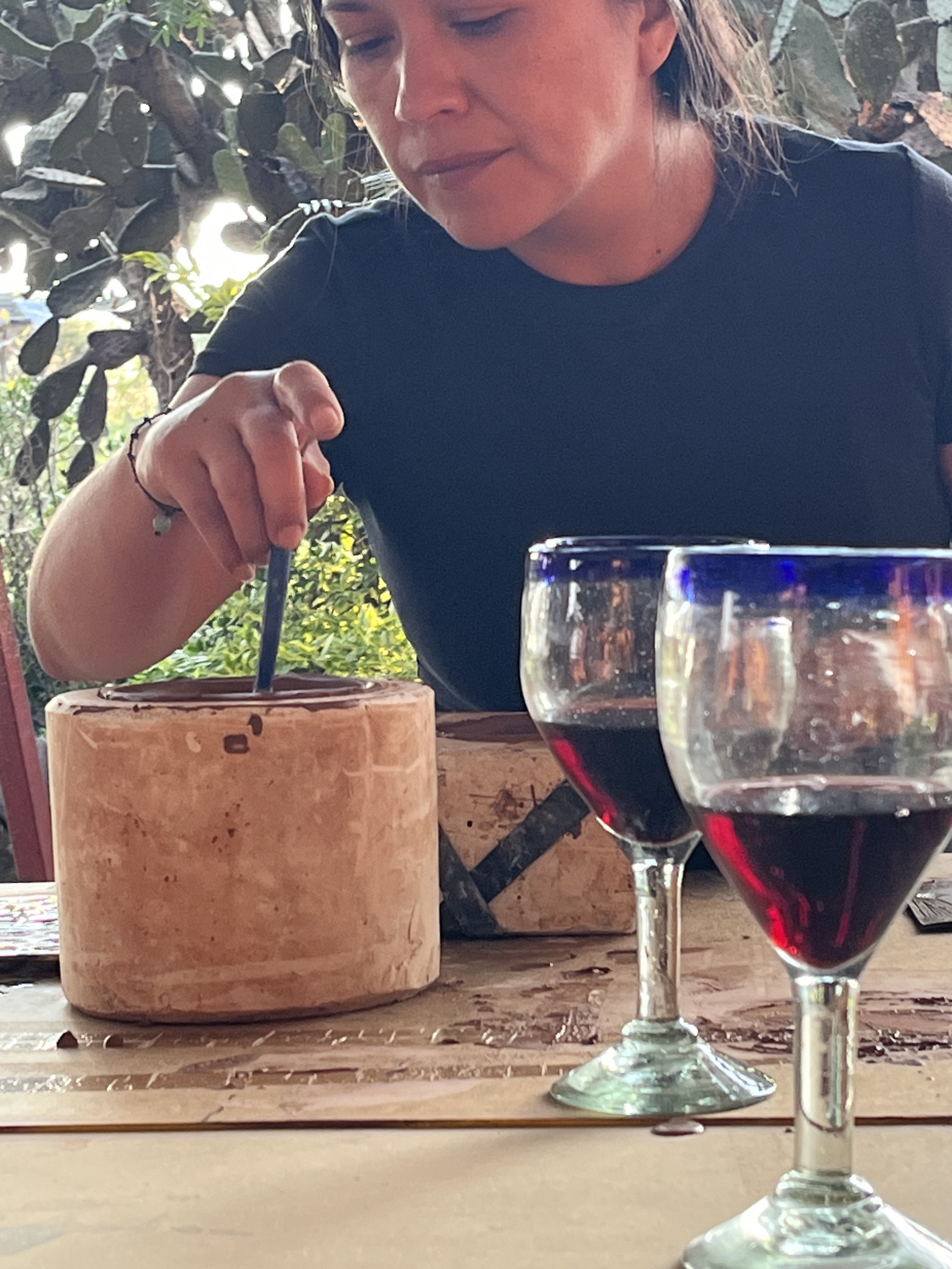 Participant painting during a wine and art experience