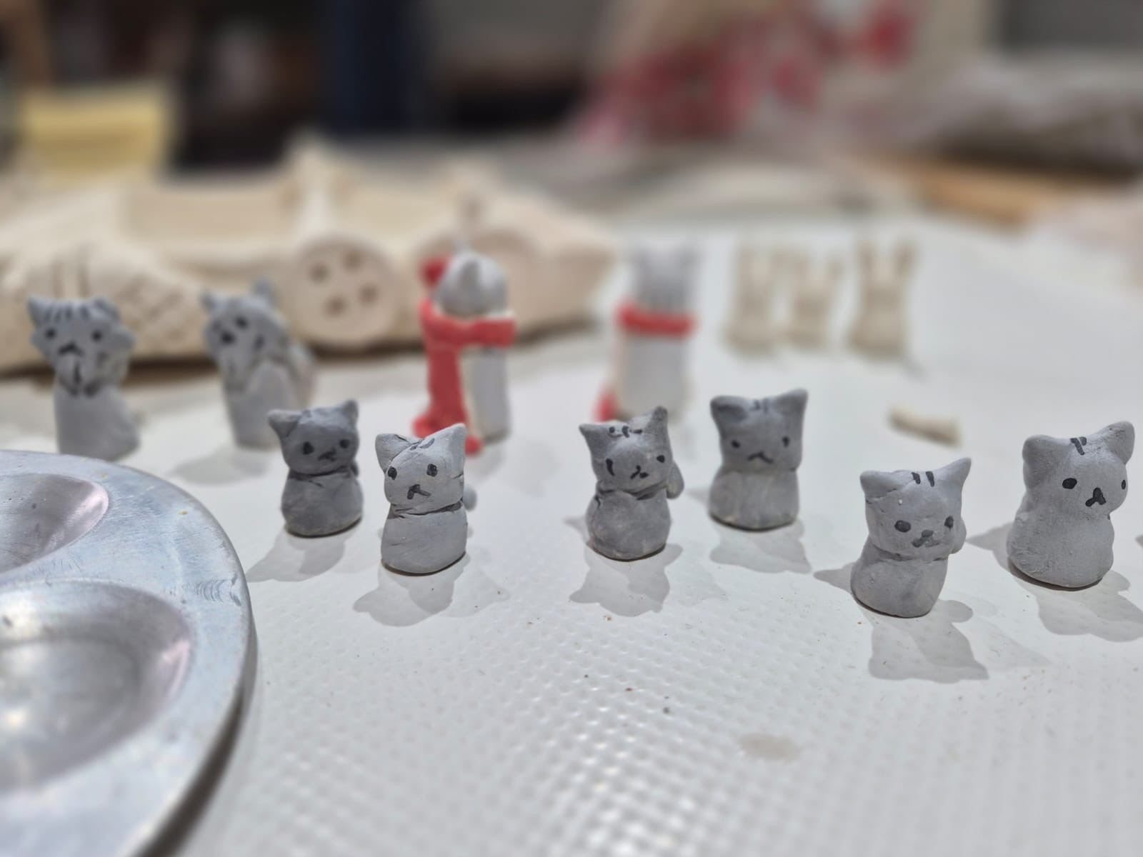 Hand-built ceramic cat chess characters by Edd