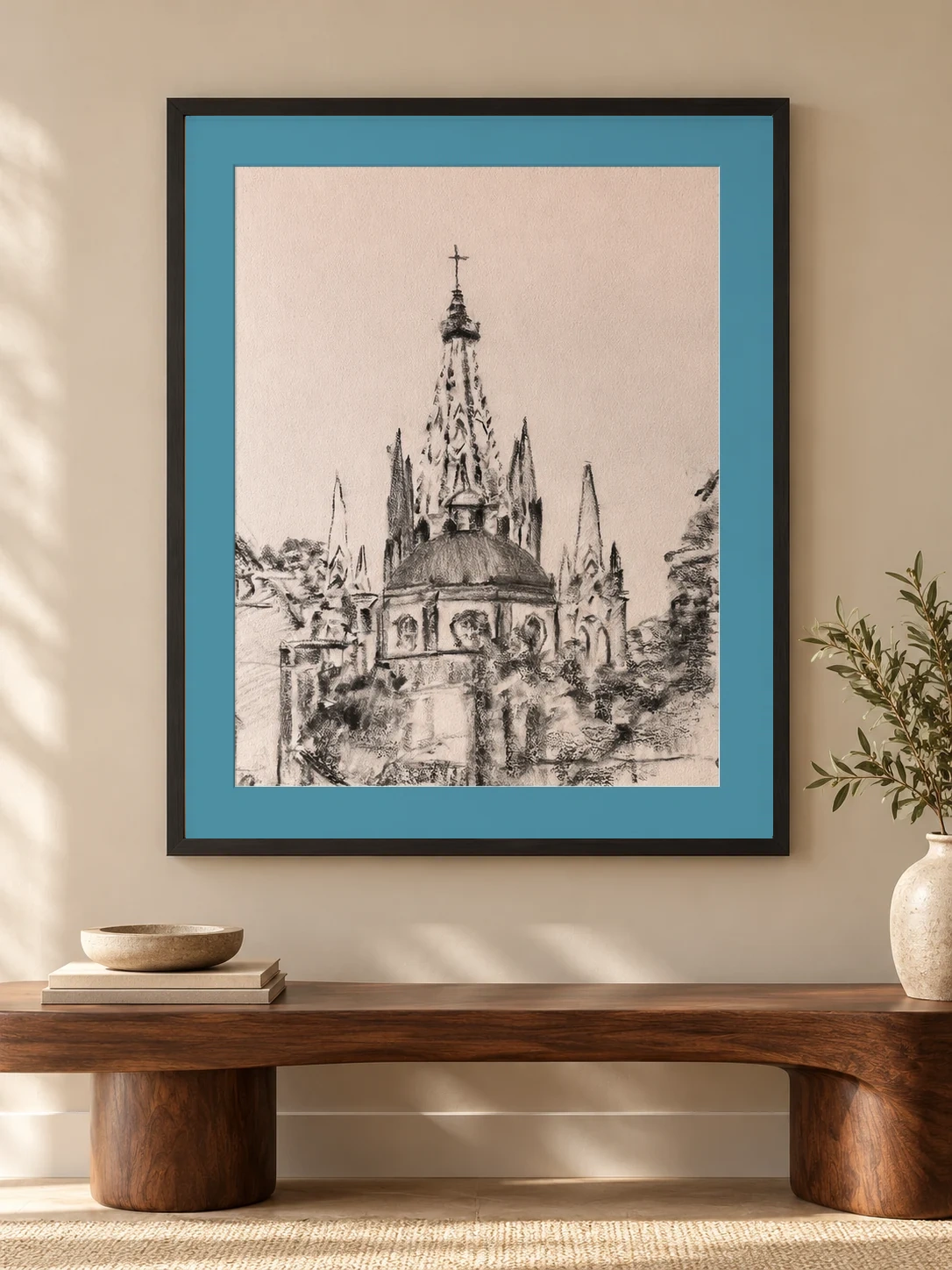 Charcoal drawing of the parish cupola in a black frame with turquoise mat