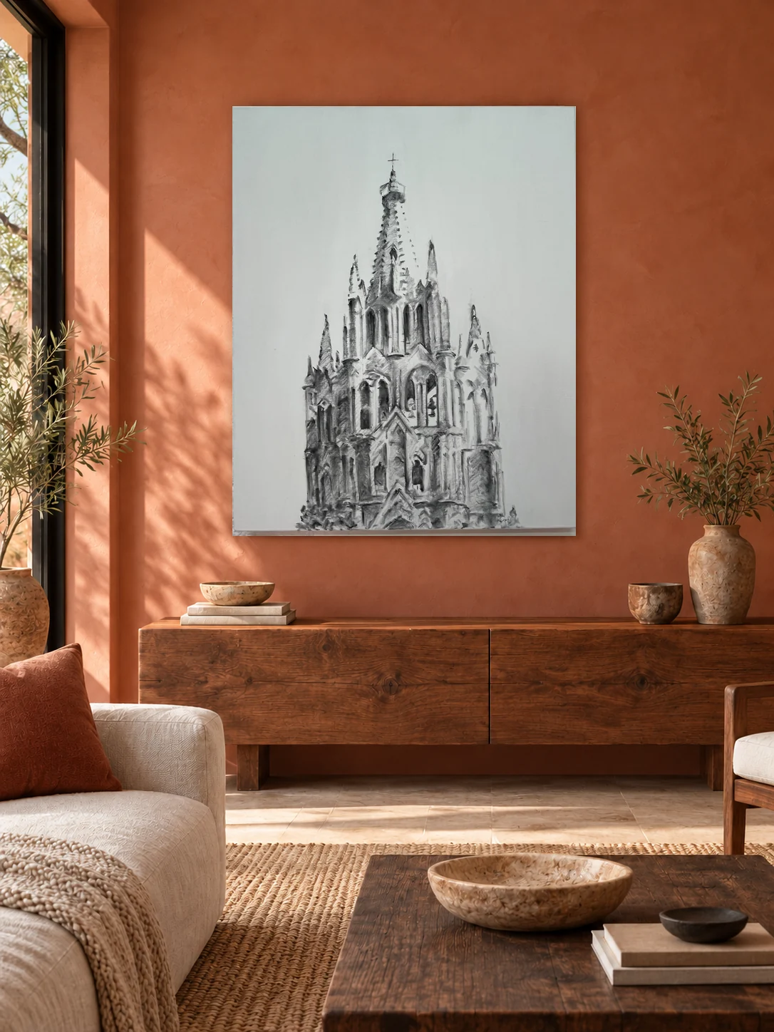 Charcoal drawing of the parish on an unframed 80 × 100 cm canvas, displayed in a terracotta living room
